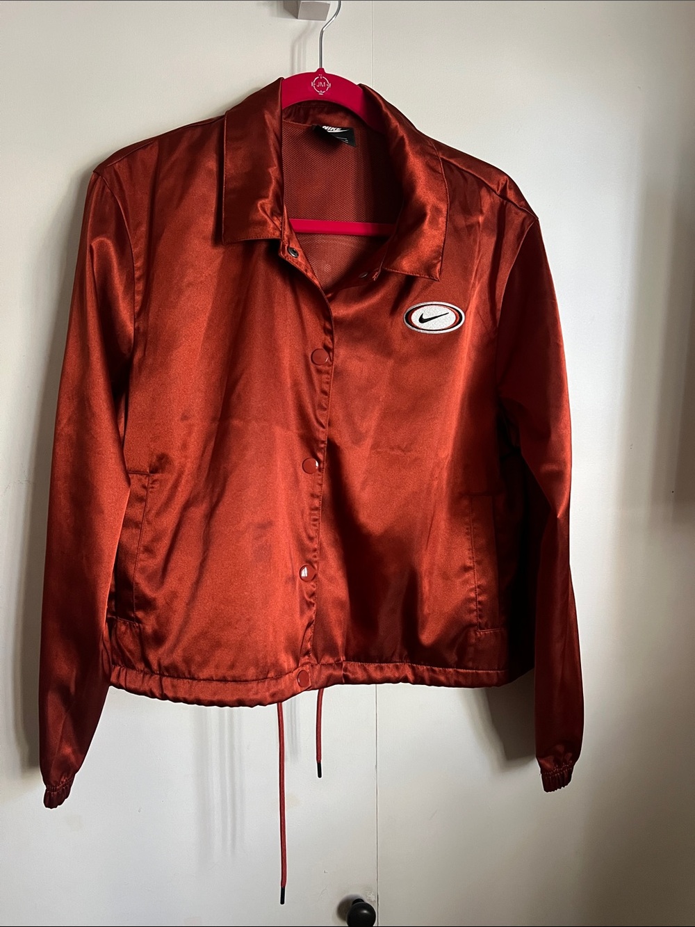 Nike Women's Satin Bomber Jacket in Rust Orange